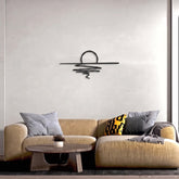 Sunset Metal Wall Art (60x27cm) in Texture Black, hung above a sofa