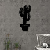 Hugz metal wall art in Texture Black, 22.5x49cm, displayed on a living room wall