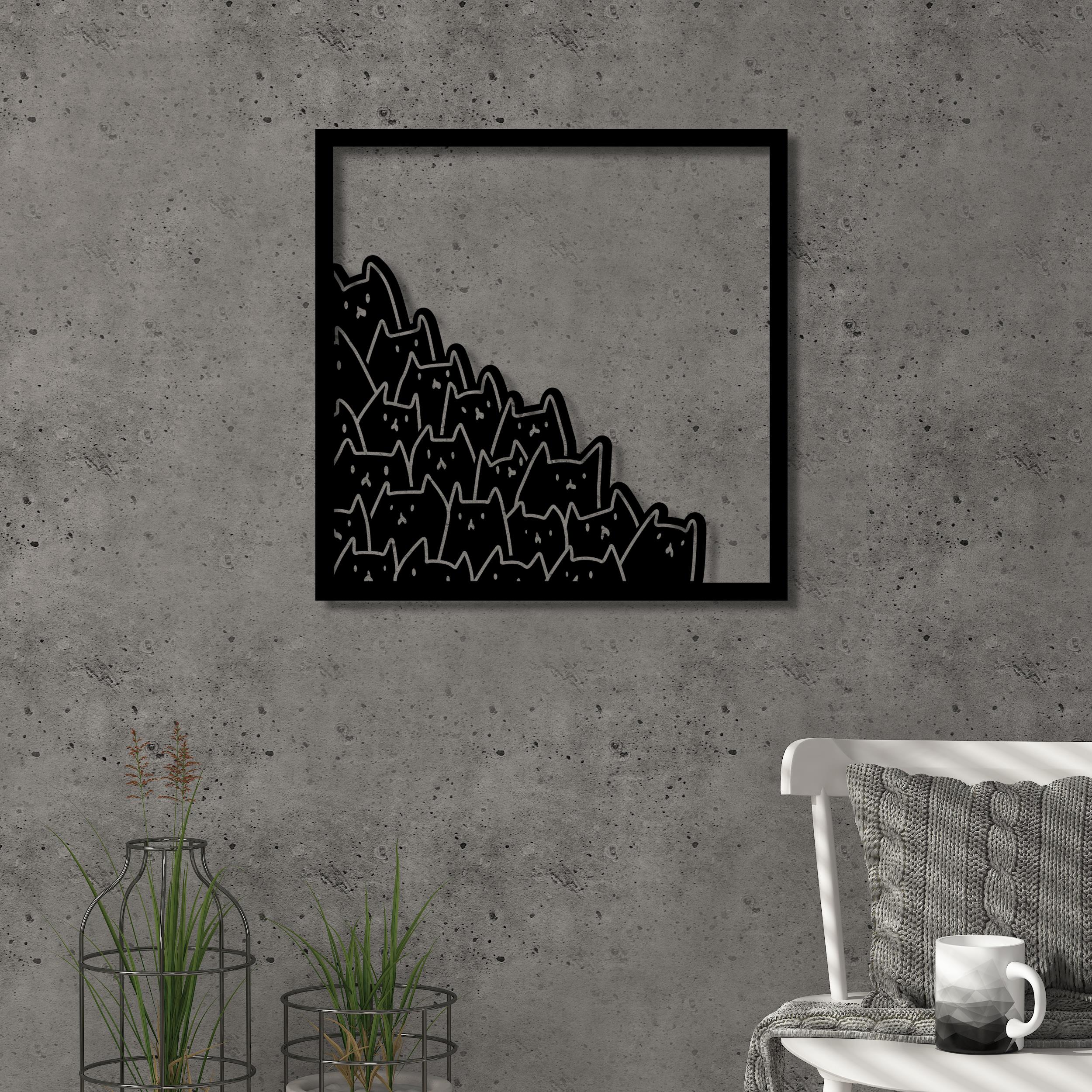Meow metal wall art in Texture Black hanging above a sofa in a living room, 49x49cm