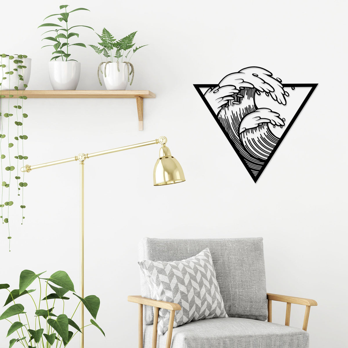 Waves metal wall art in Texture Black hung above a sofa in a living room, 60x56cm