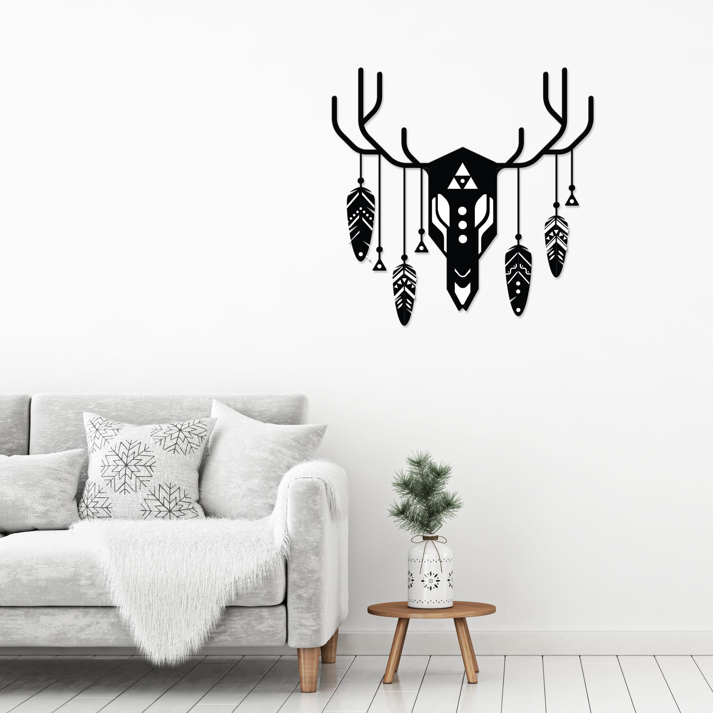 Deer Totem metal wall art, 60x60cm, hung above a sofa in a living room