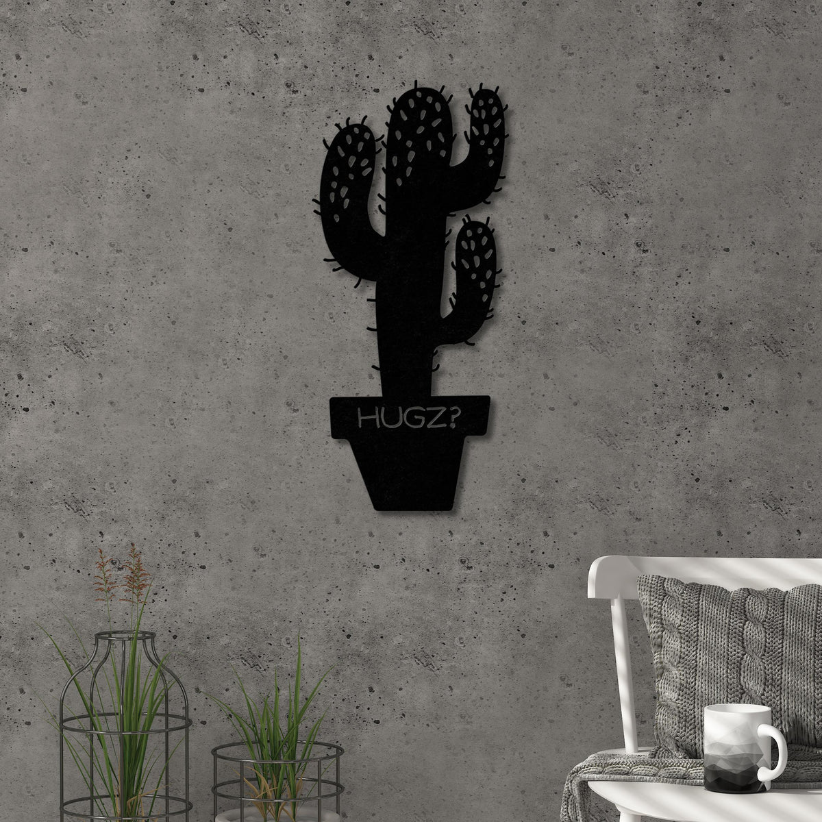 Hugz metal wall art in Texture Black, 22.5x49cm, displayed on a living room wall