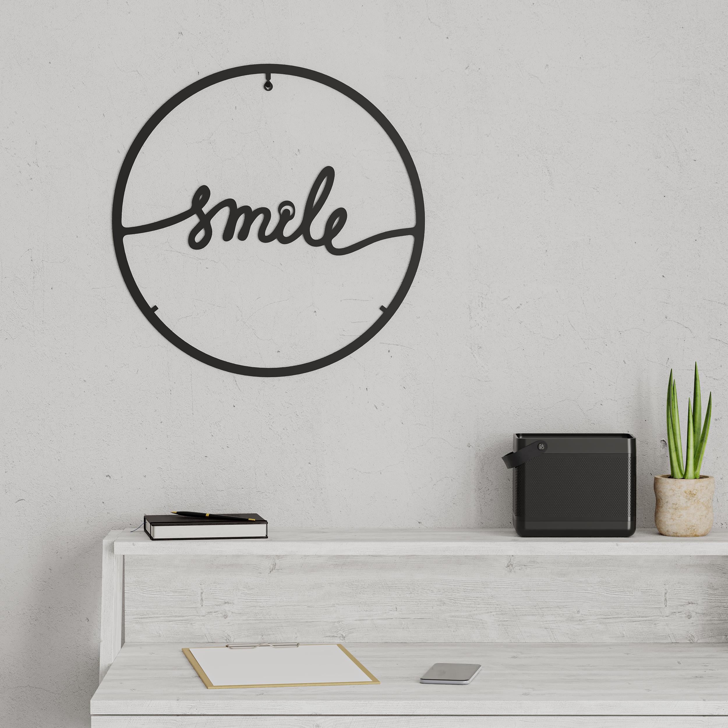 Additional angle shot of the Smile metal wall art in Texture Black, 45cm diameter