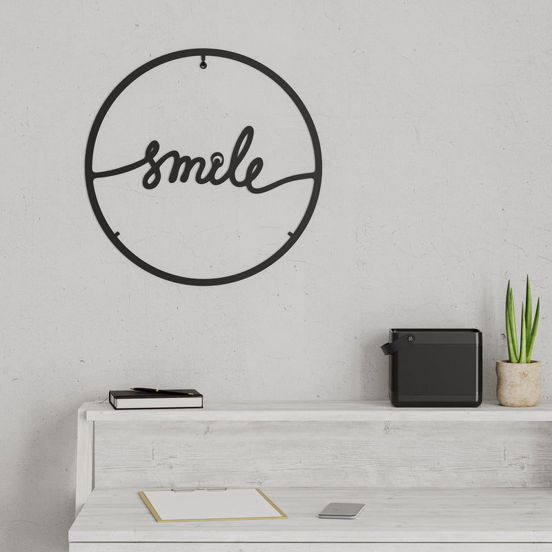 Additional angle shot of the Smile metal wall art in Texture Black, 45cm diameter