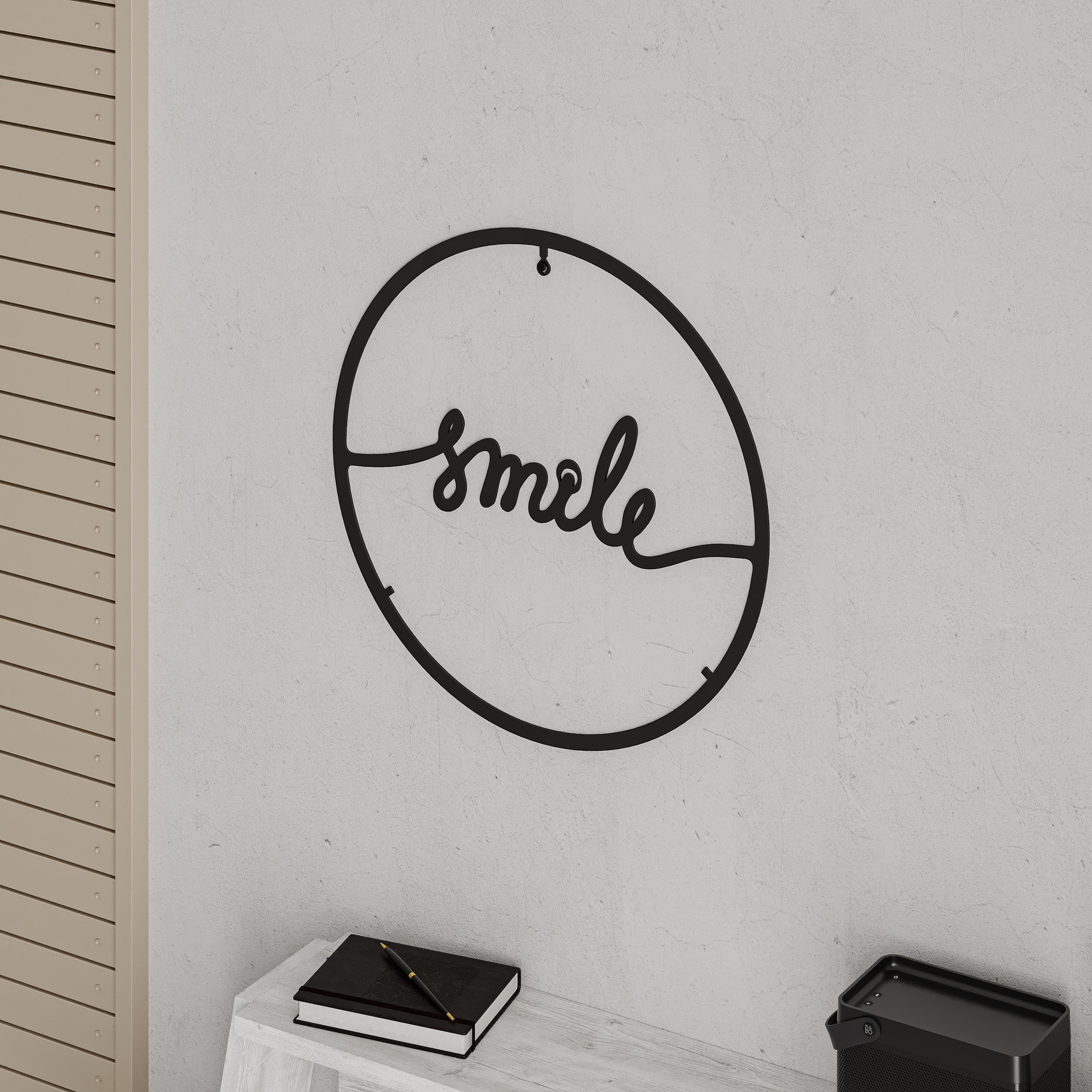 Close-up detail shot of the cut-metal edge of the Smile metal wall art, Texture Black, 45cm diameter