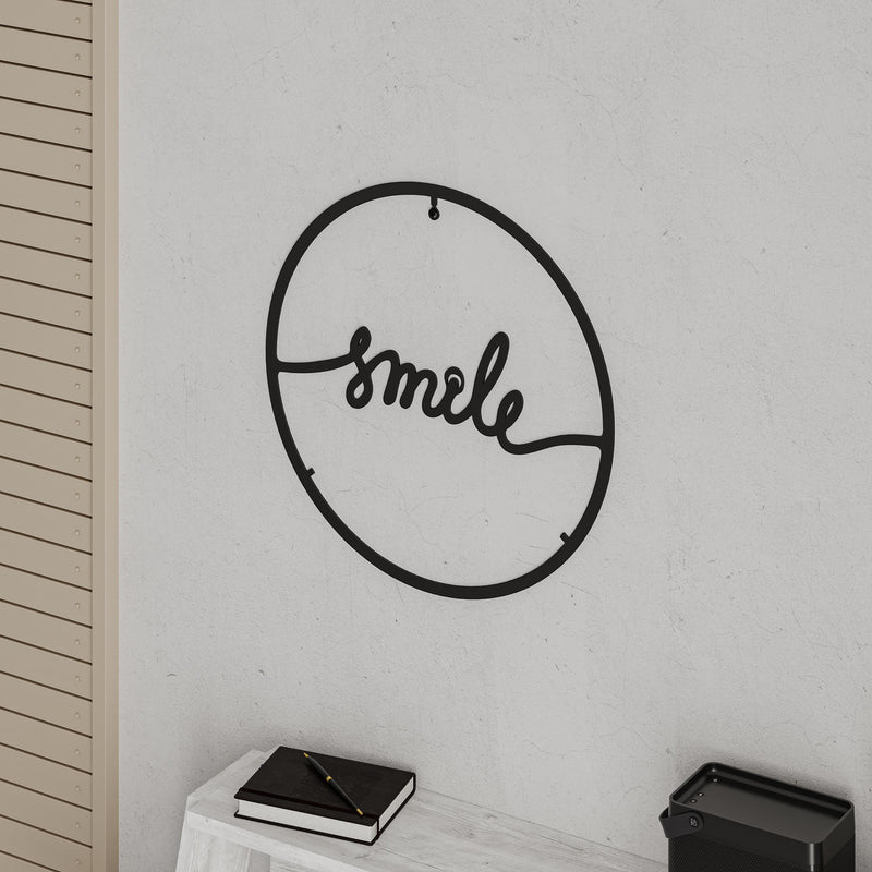 Close-up detail shot of the cut-metal edge of the Smile metal wall art, Texture Black, 45cm diameter