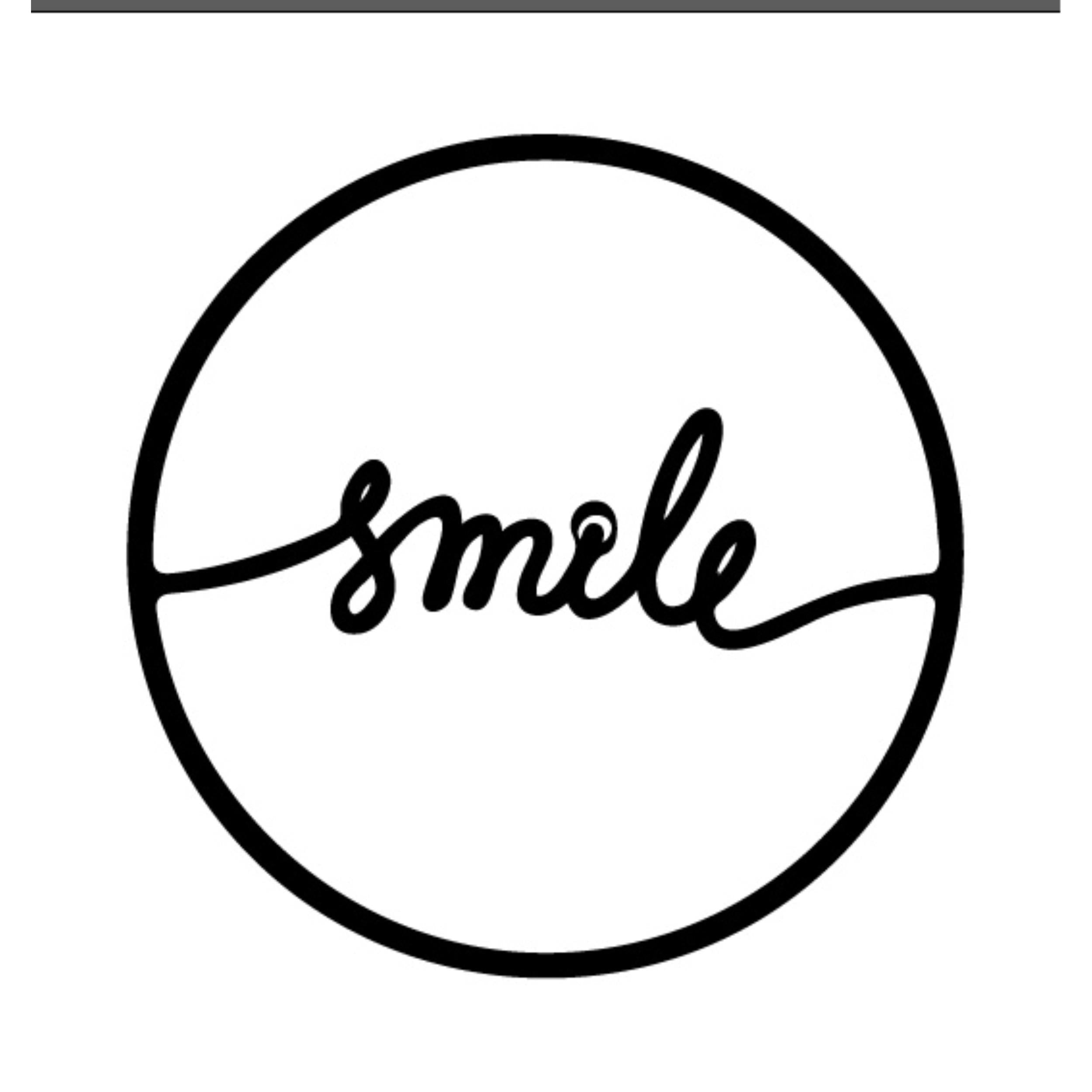 Smile metal wall art in Texture Black, 45cm diameter, on a plain white background