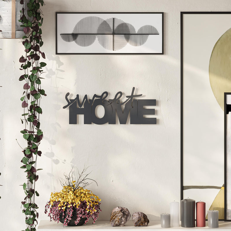 Sweet Home metal decorative wall art in Texture Black hanging in a hallway, 35x14cm
