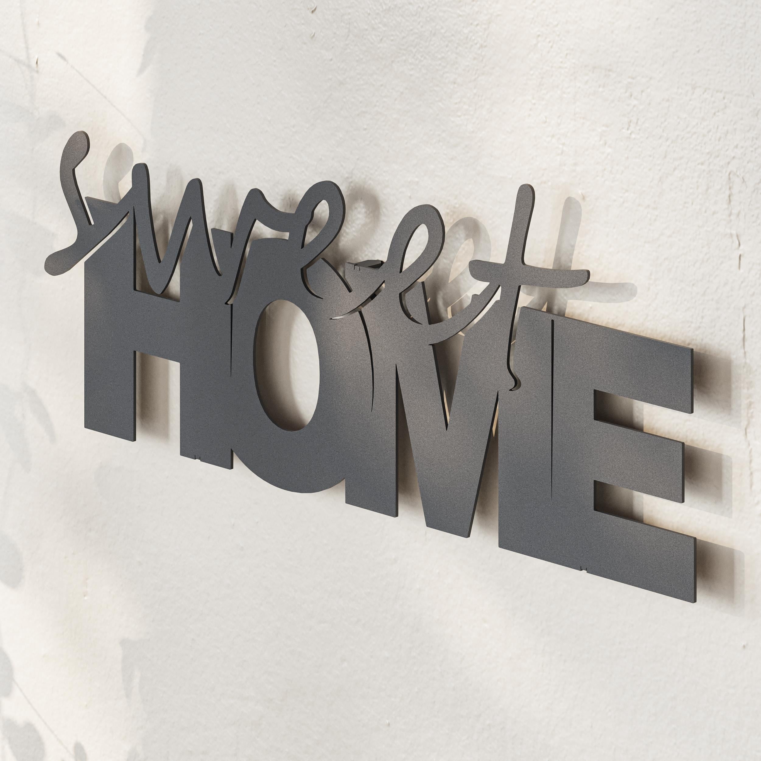 Close-up detail of the cut lettering on the Sweet Home metal decorative piece