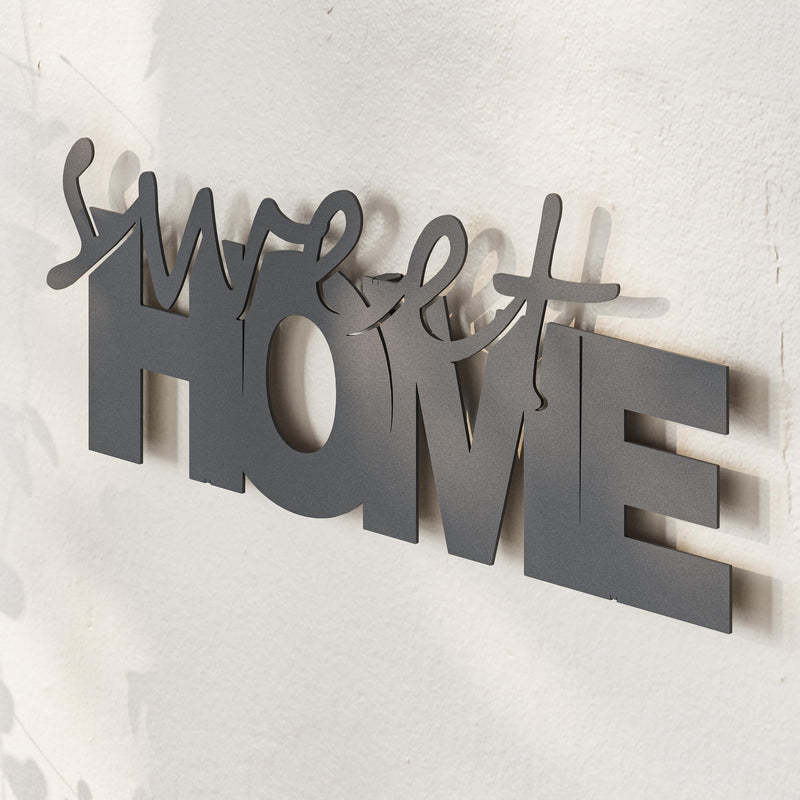 Close-up detail of the cut lettering on the Sweet Home metal decorative piece