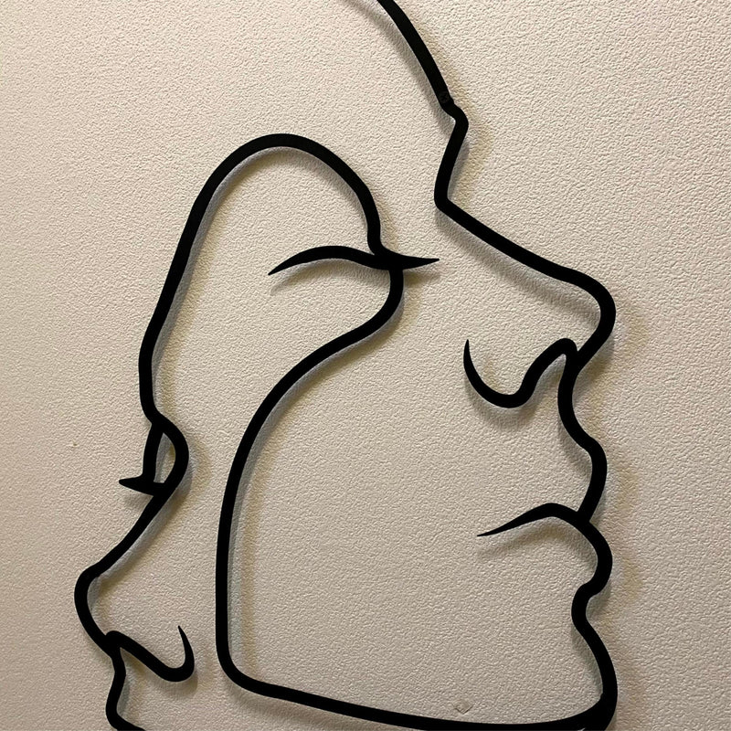 Close-up detail of the Two Face Metal Wall Art two overlapping profiles