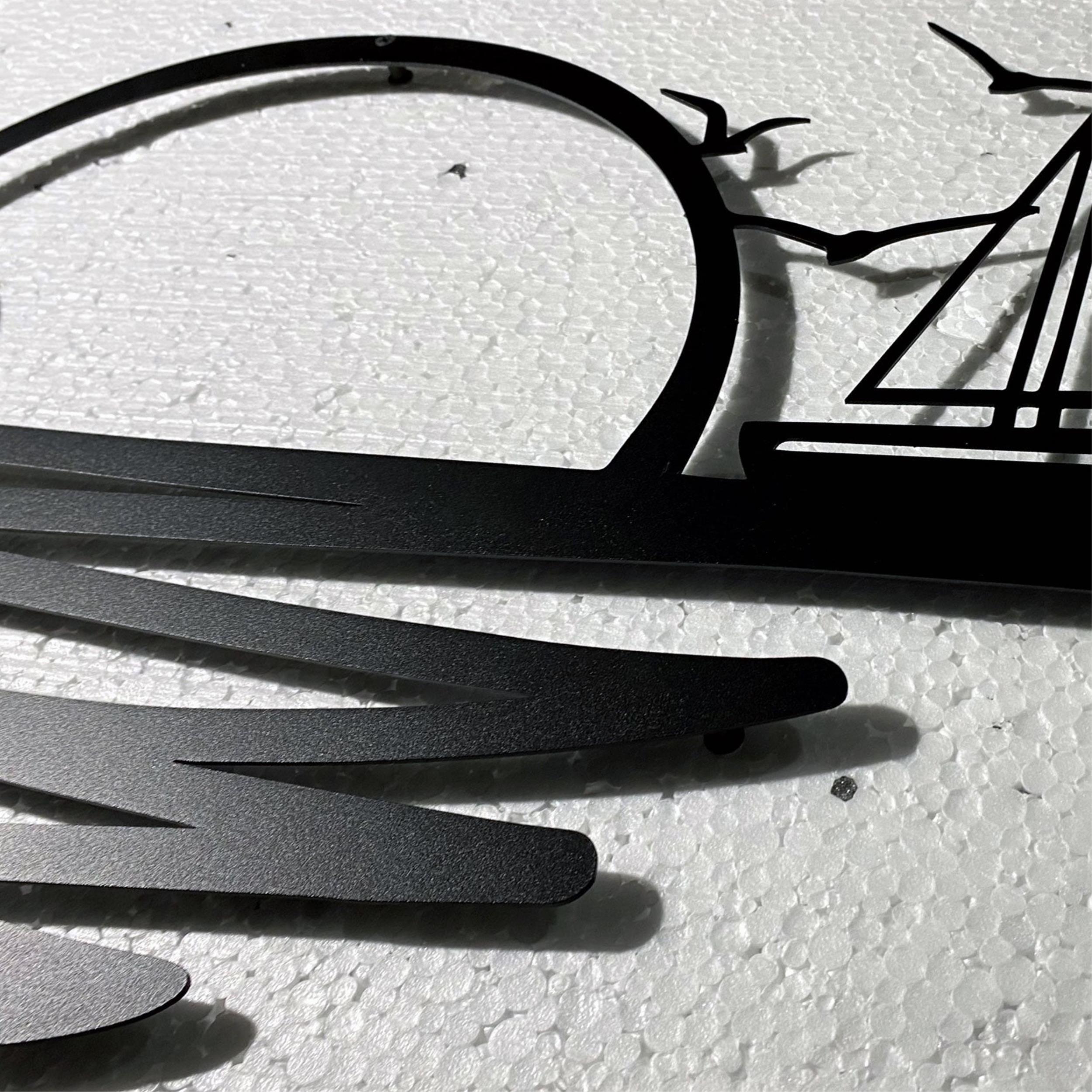 Close-up detail of the Rising Sun Metal Wall Art sailing boat